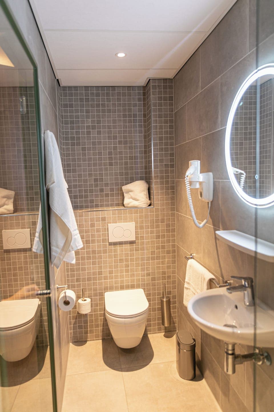Shower, rainfall showerhead, hair dryer, towels