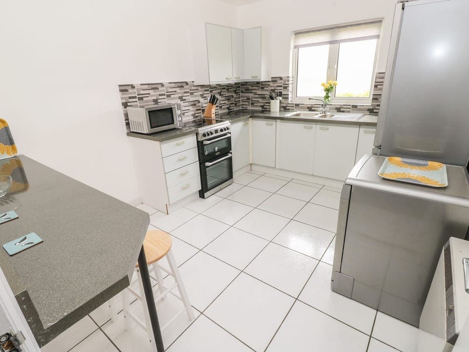 Fridge, electric kettle, toaster, cookware/dishes/utensils