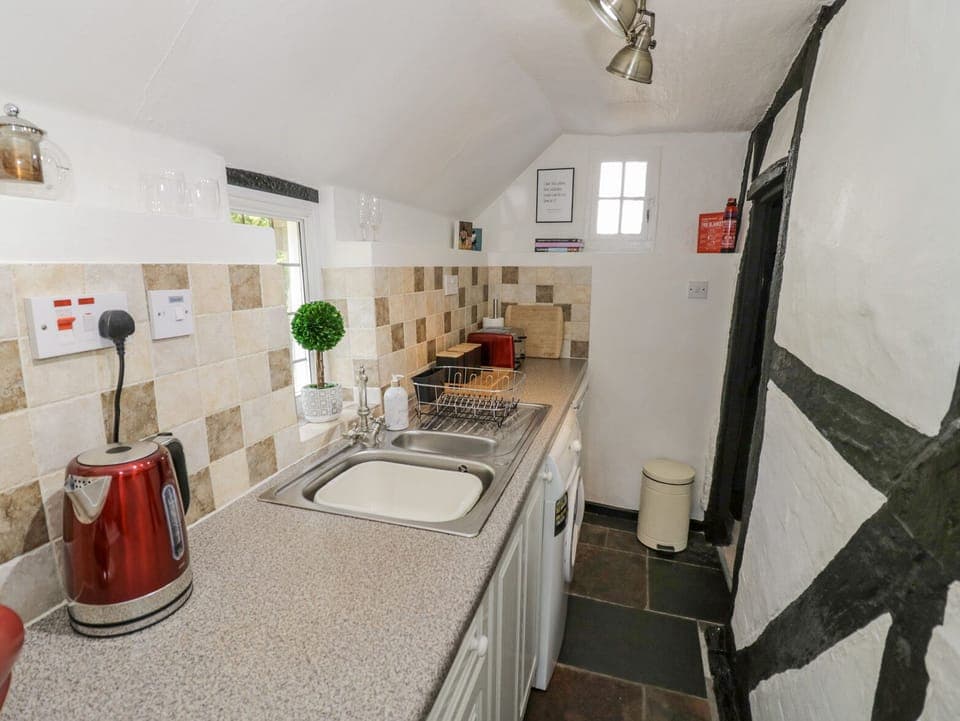 Fridge, electric kettle, toaster, cookware/dishes/utensils