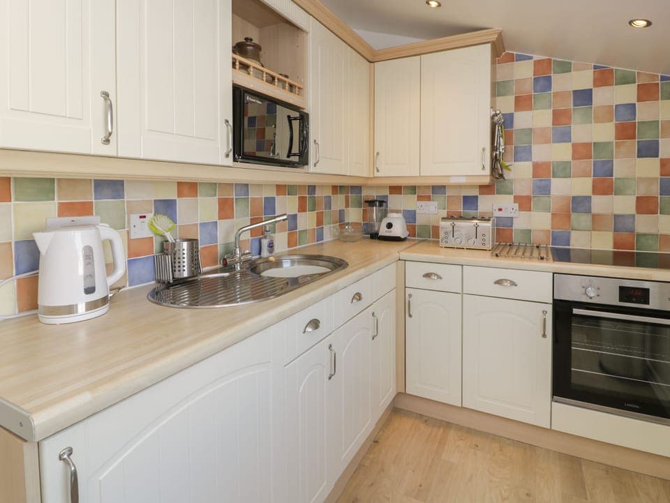 Fridge, electric kettle, toaster, cookware/dishes/utensils