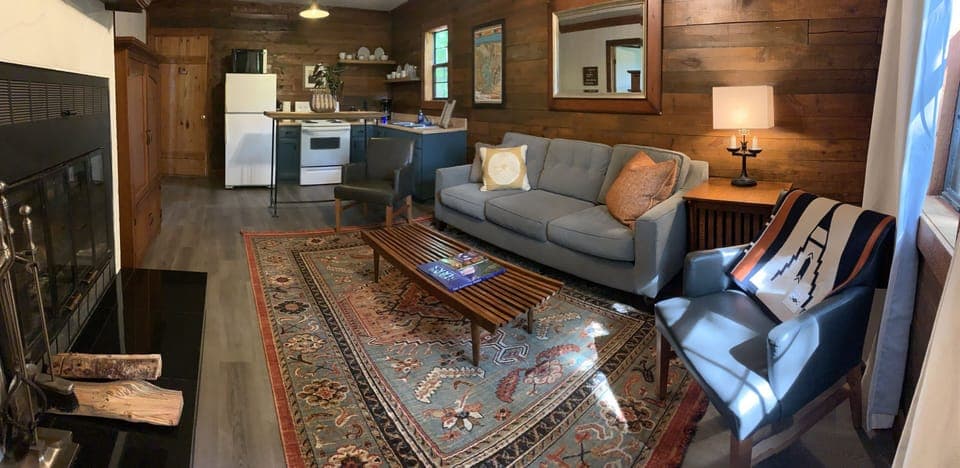 Log Cabin + Hot tub + Kitchen + Fireplace at Loblolly Pines | Living area | 42-inch flat-screen TV with cable channels