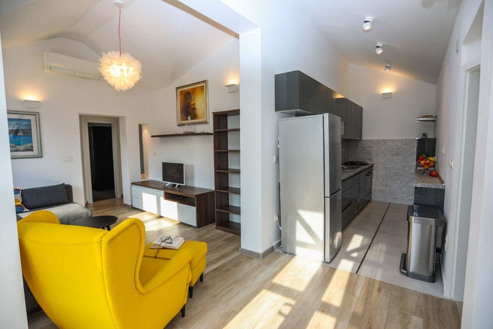 Superior Apartment, 2 Bedrooms, Sea View | Living area | 32-inch LED TV with cable channels, TV, heated floors