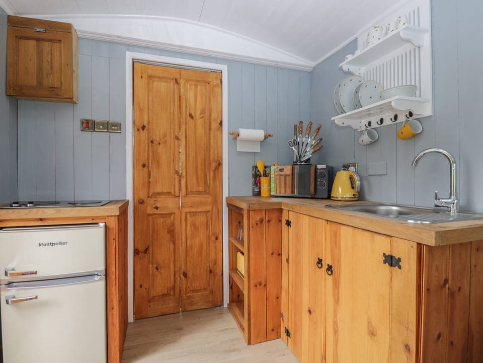 Fridge, electric kettle, toaster, cookware/dishes/utensils