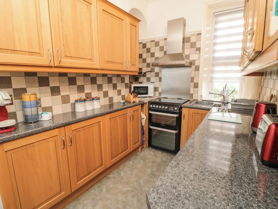 Fridge, electric kettle, toaster, cookware/dishes/utensils