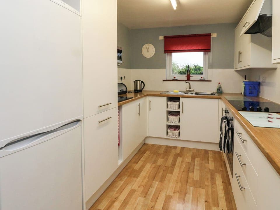 Fridge, electric kettle, toaster, cookware/dishes/utensils