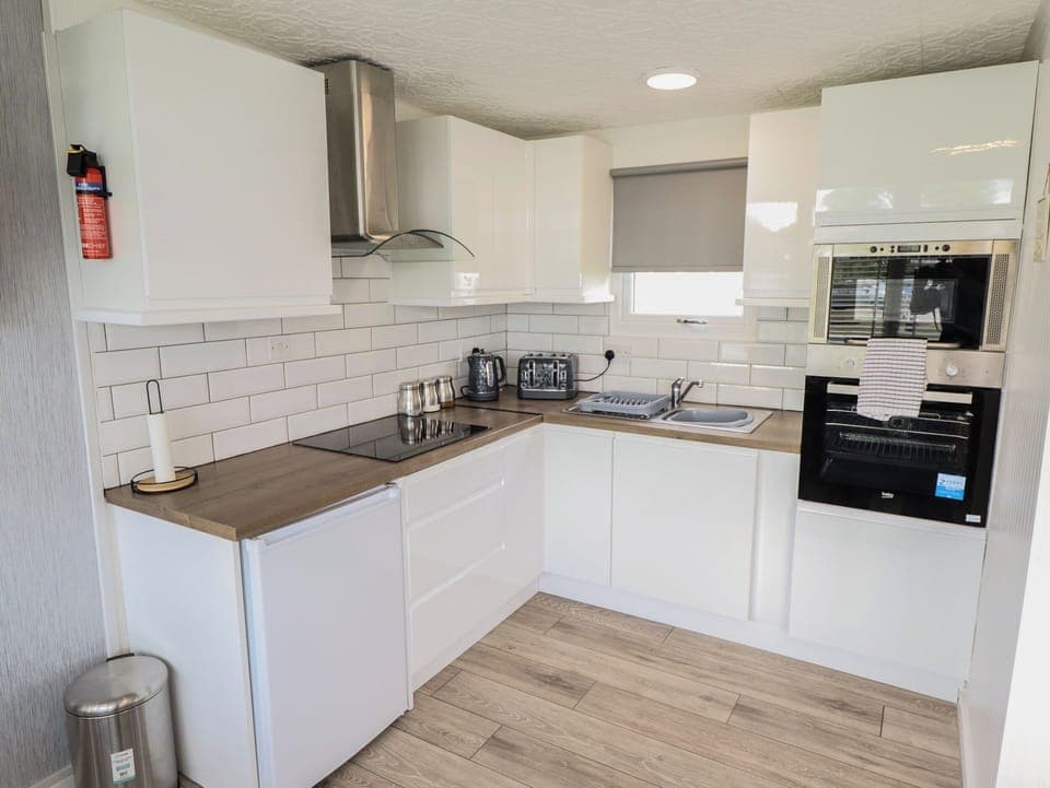 Fridge, electric kettle, cookware/dishes/utensils