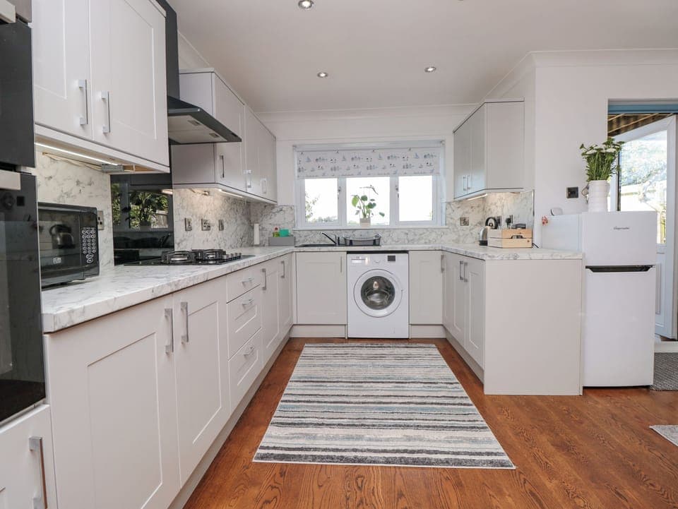 Fridge, electric kettle, toaster, cookware/dishes/utensils