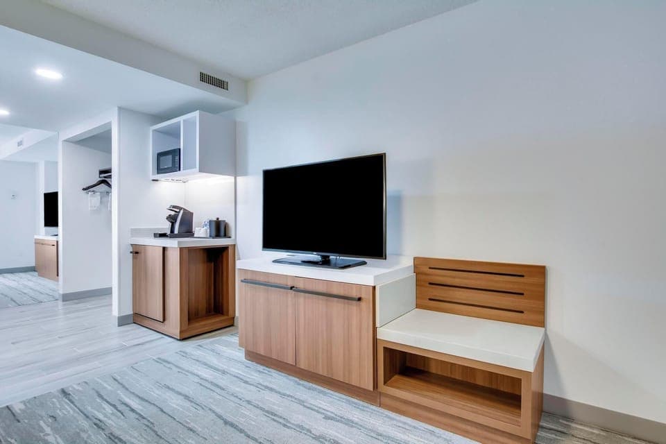 Desk, laptop workspace, blackout drapes, iron/ironing board