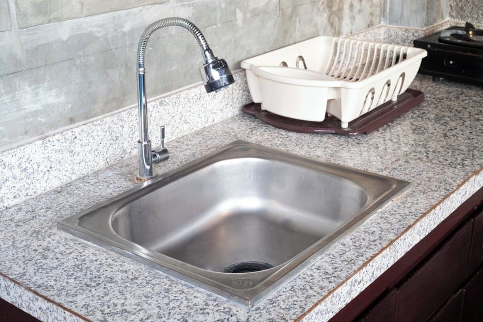 Microwave, electric kettle, cookware/dishes/utensils, dining tables