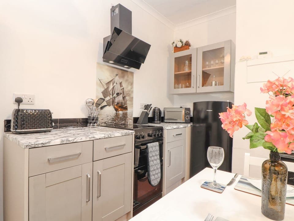 Fridge, electric kettle, toaster, cookware/dishes/utensils