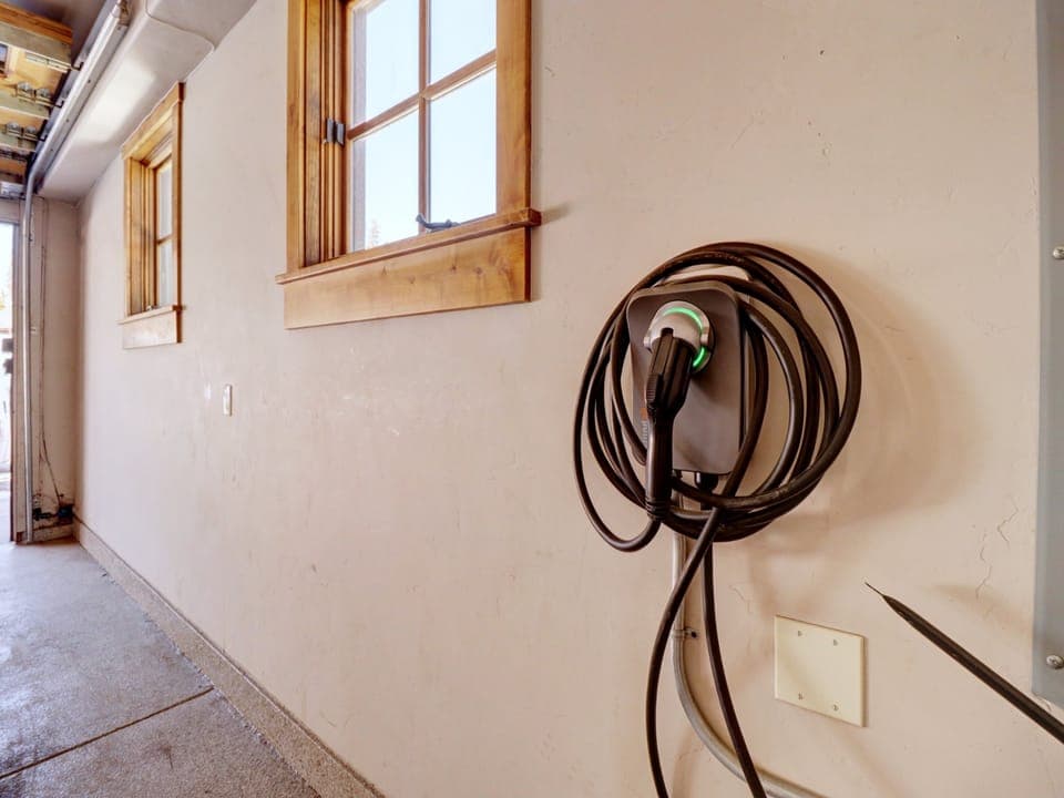 The garage features an EV charger.