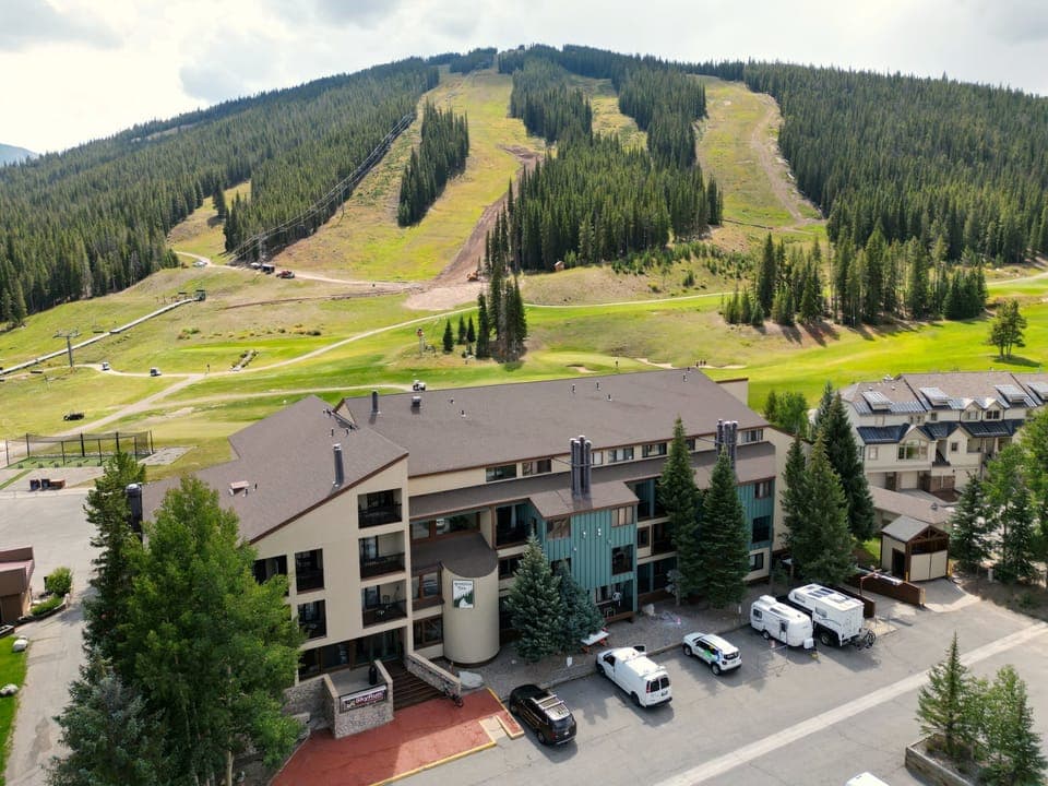 Aerial view of Foxpine with East Village ski runs in the background.