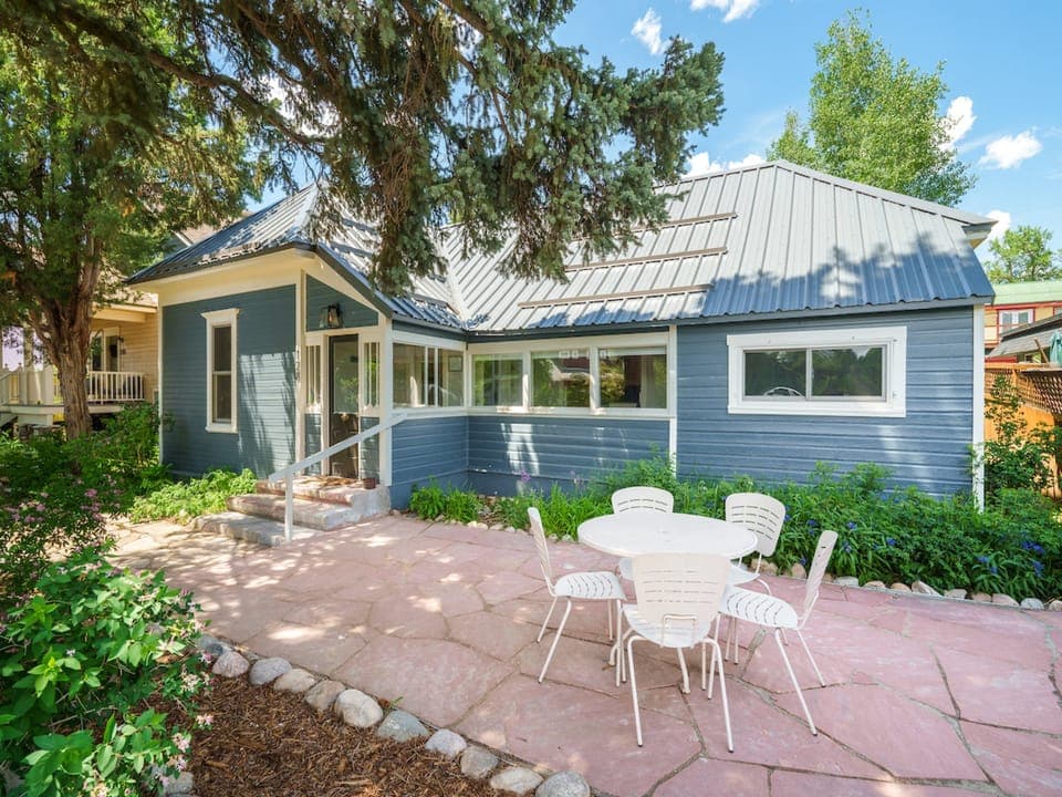 This historic home is located in the heart of downtown Steamboat, walking distance to restaurants and shops. - house, trees
