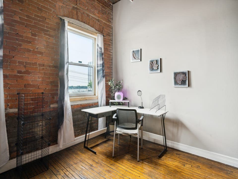 Peaceful office workspace area overseeing the waterfront cross-view, multi-colored wi-fi cube speaker