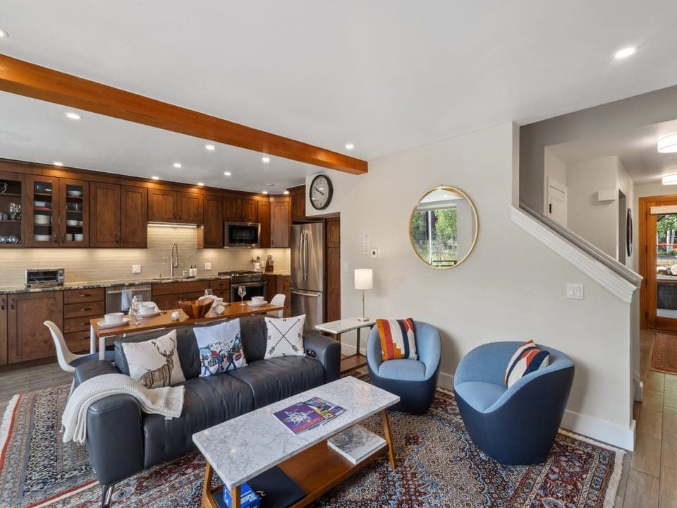 The first level opens up to a large living room, kitchen and spacious deck with plenty of natural light and a gas fireplace.