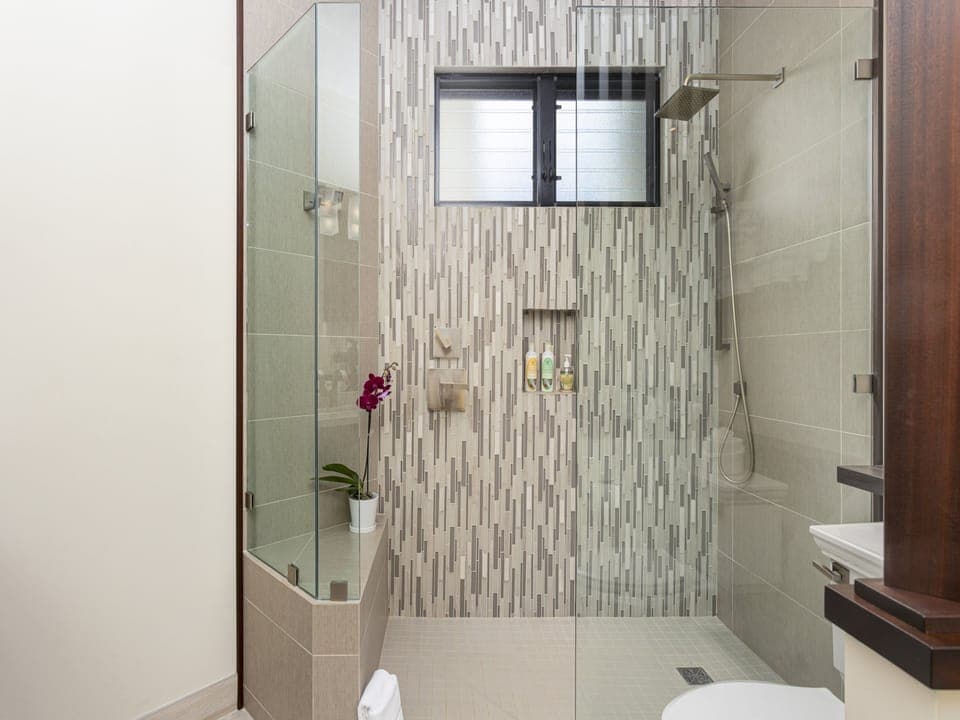 The second en-suite bathroom has a walk-in spa style shower.