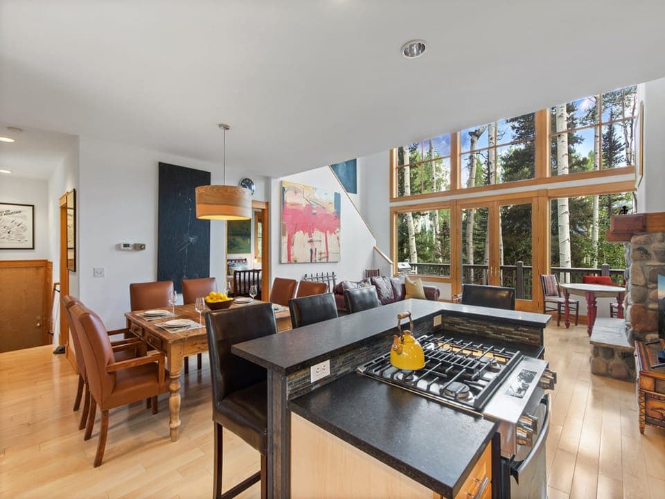 The dining Kitchen area is a spacious open space overlooking the living room with stunning views of the mountains outside.