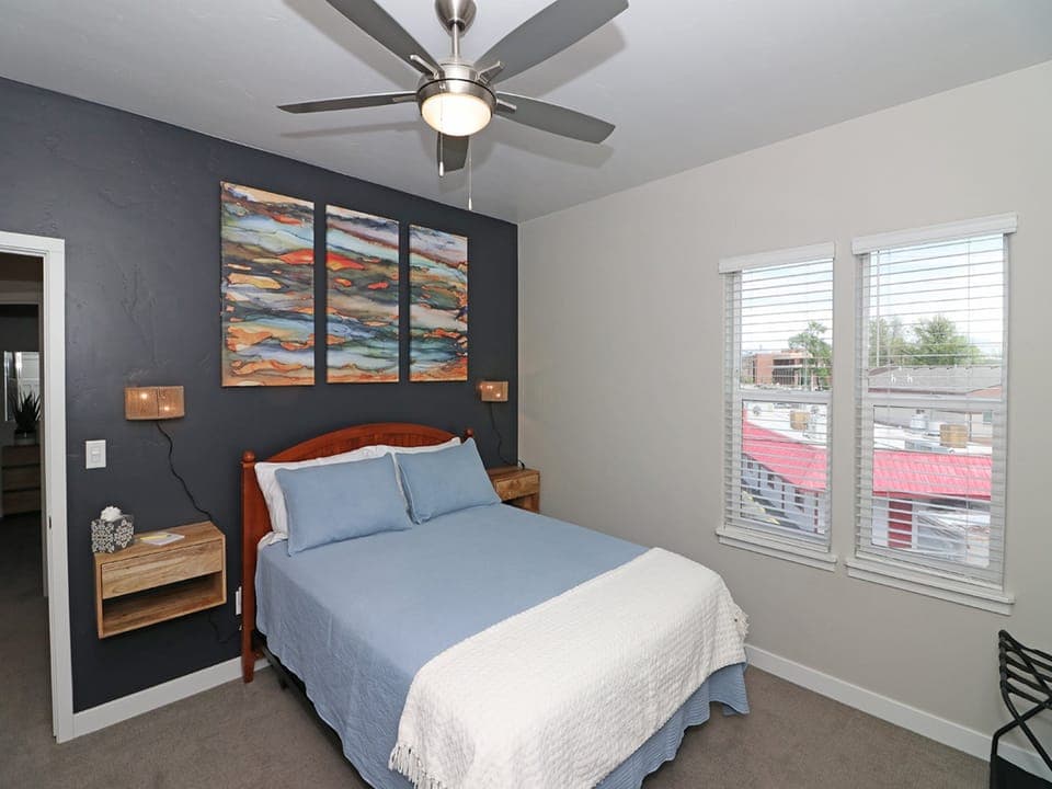 Master bedroom with queen bed and private balcony