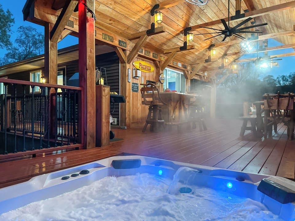 At the edge of the deck, the hot tub!