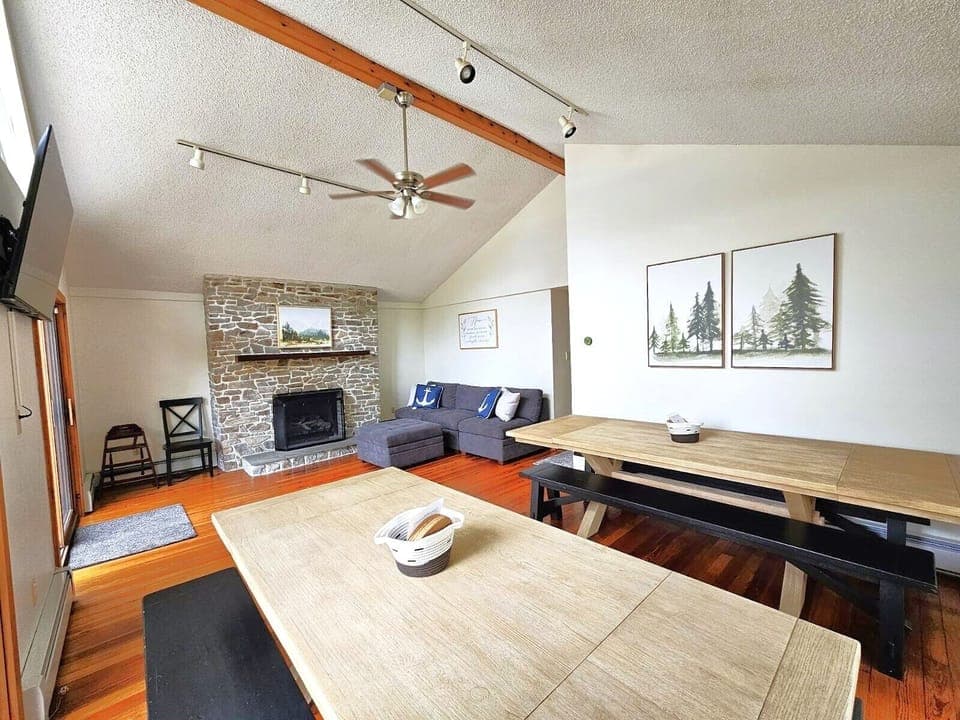 Great room with sofa and enough seats for 12 to dine
