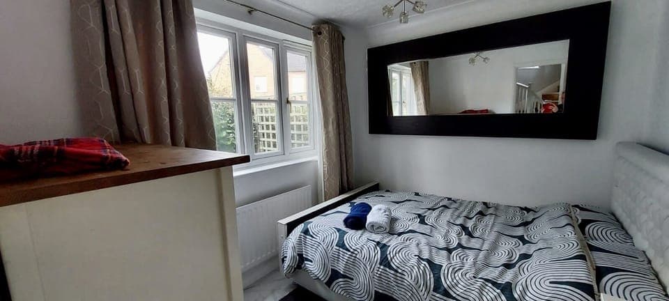 Ground floor double bedroom with storage and private view. 