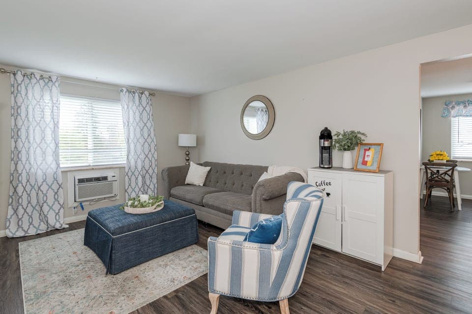 Sofa & chair, with ottoman for extra seating.   55 inch Roku smart TV.  High Speed Wi-fi, great for the business traveler 