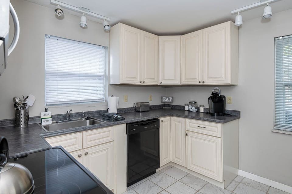 Whether you're reheating takeout or channeling your inner Gordon Ramsay, this bright and cheerful kitchen has your back. Fully stocked with essentials, a Keurig for that first morning brew, and plenty of counter space for pancake flipping or pizza slicing.