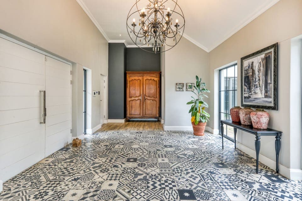 Entrance hall with guest toilet , study, guest suite all on this level.