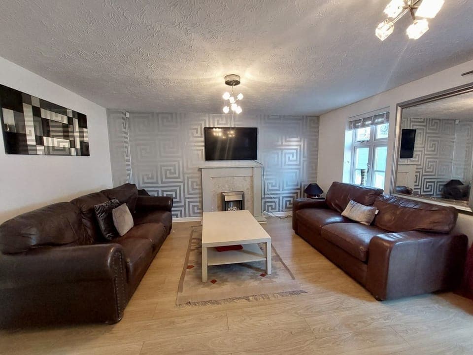 Spacious and cosy living room with plenty of seating. 