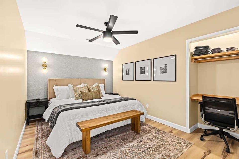 This bedroom is the perfect place to relax and unwind after a long day, or to get some work done in a quiet and comfortable setting.