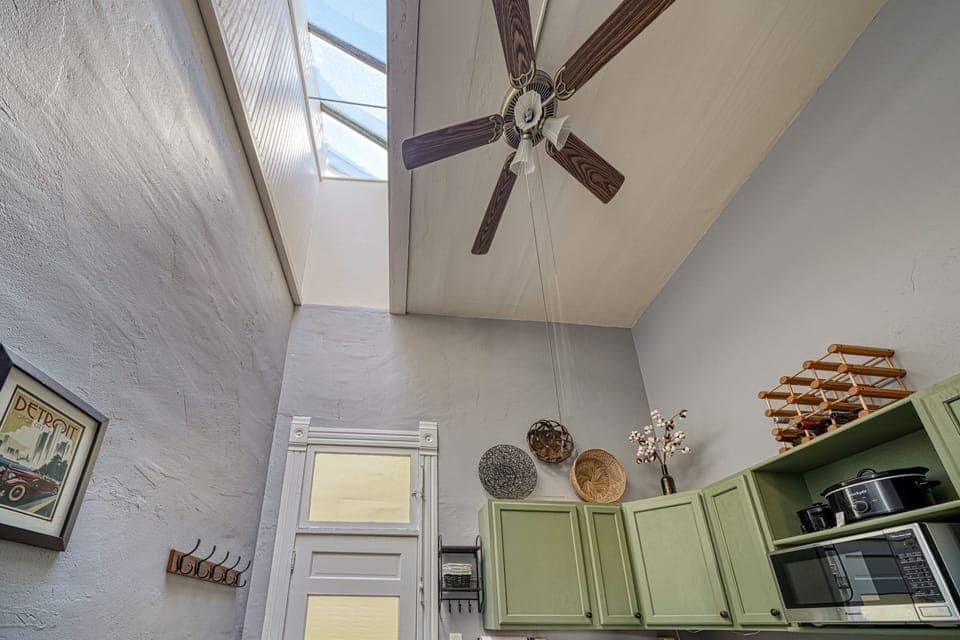 This bright sunny apartment has tall ceilings with skylights