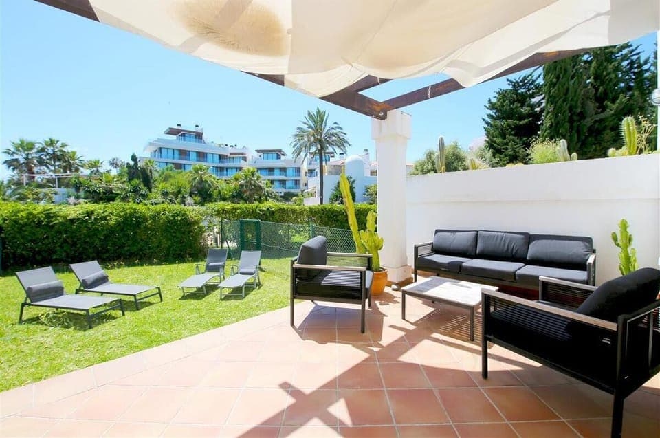 Private terrace with outdoor seating area and private garden with sun loungers