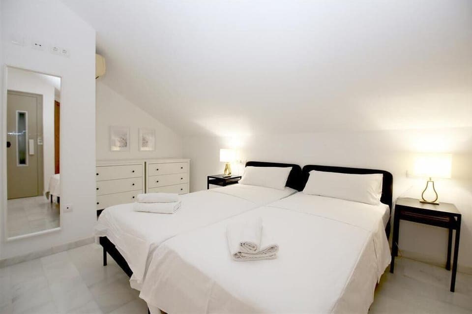 Fourth bedroom with two single beds, en-suite bathroom and private terrace