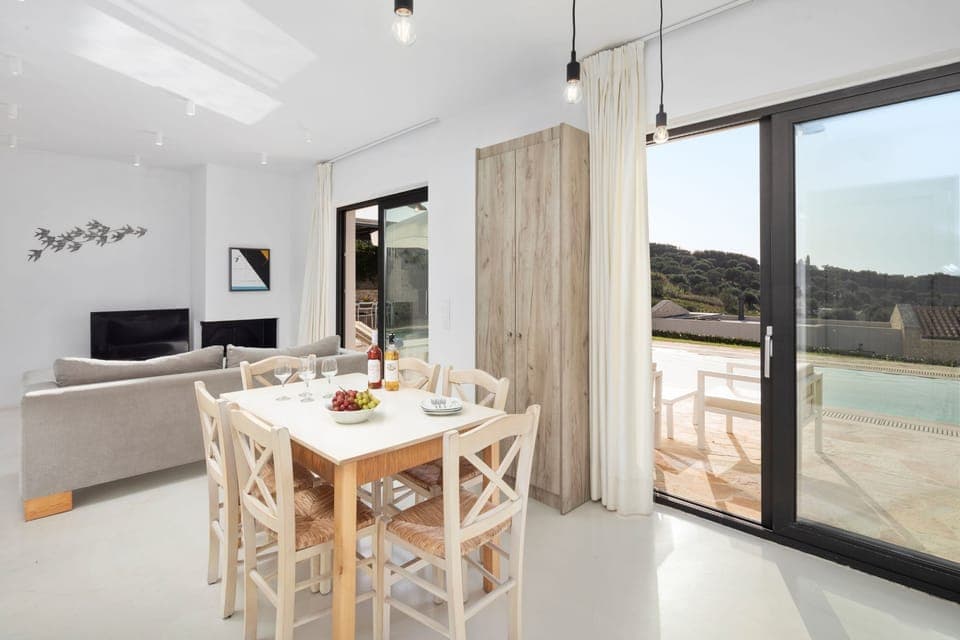 Dining and living area with charming views