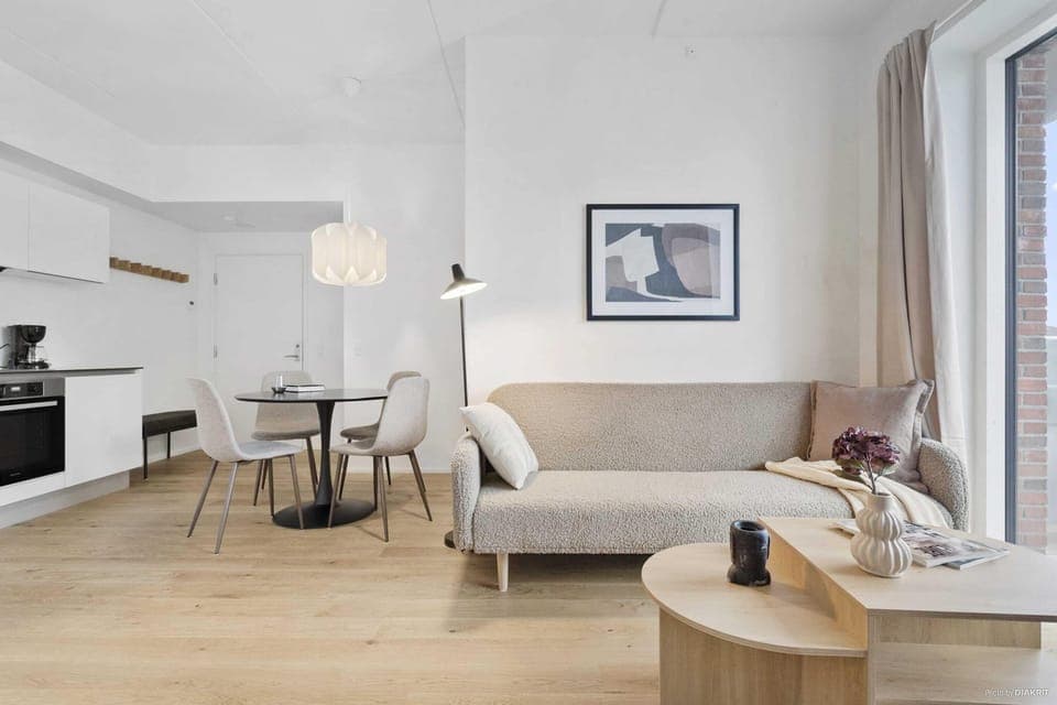 Cozy living room to unwind and relax with direct access to private balcony