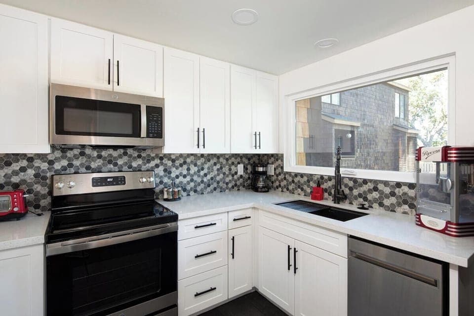 stainless steel appliances for the win! Enjoy using this new electric stove, microwave and dishwasher. 