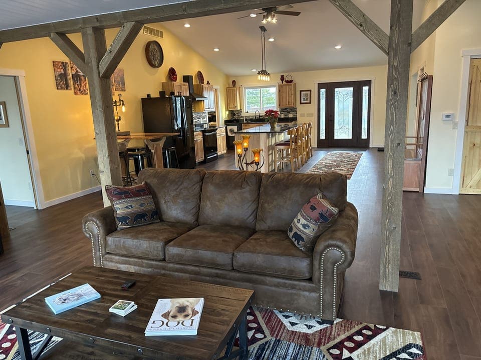 Living room with Dish tv and open to kitchen. 