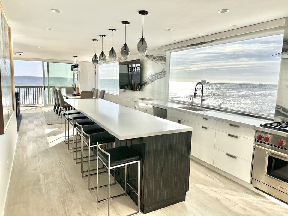 Kitchen island and dining room with seating for 14 for dinner!