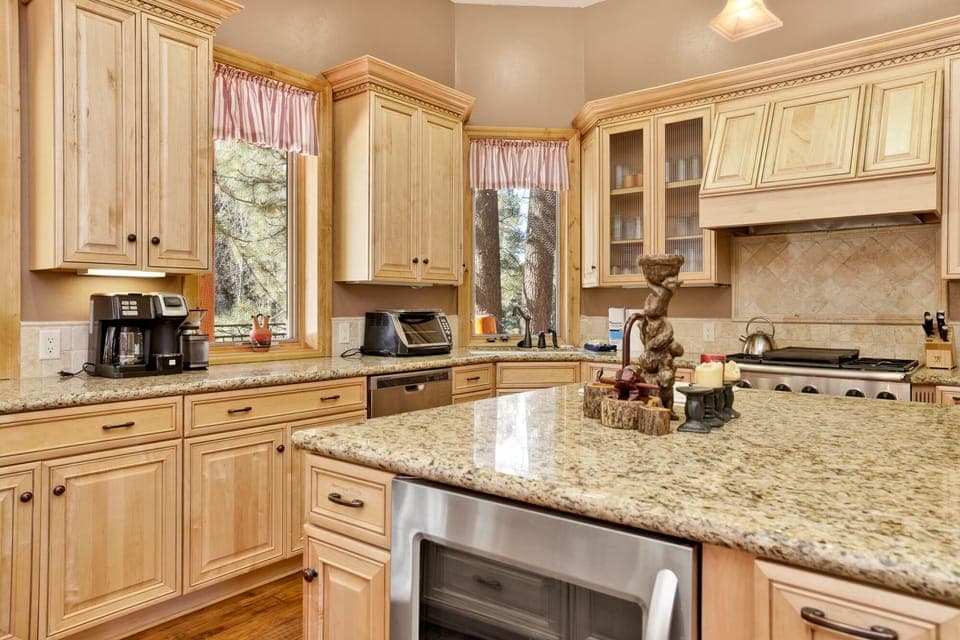 Fully equipped cabin kitchen with ample cabinetry, stove, fridge, microwave, and coffee maker—perfect for cooking meals, morning coffee, and feeling right at home on your stay.