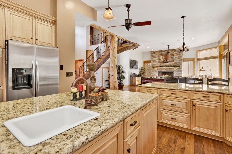 Fully equipped cabin kitchen with ample cabinetry, stove, fridge, microwave, and coffee maker—perfect for cooking meals, morning coffee, and feeling right at home on your stay.