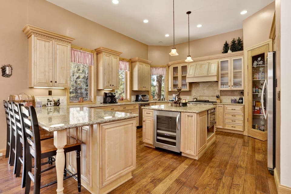 Fully equipped cabin kitchen with ample cabinetry, stove, fridge, microwave, and coffee maker—perfect for cooking meals, morning coffee, and feeling right at home on your stay.