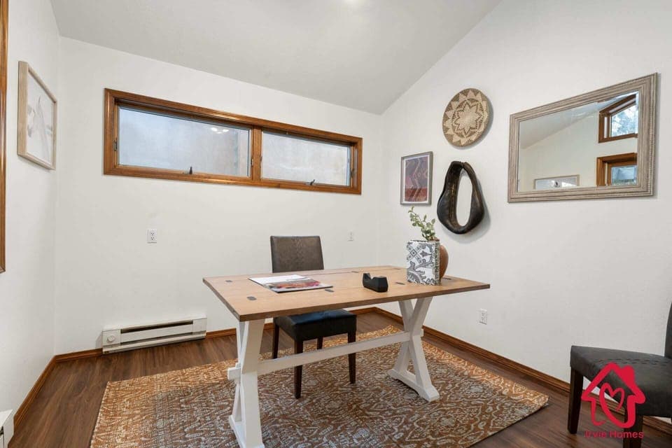 "Minimalist Home Office Design with Stylish Wooden Desk and Eclectic Wall Decor"