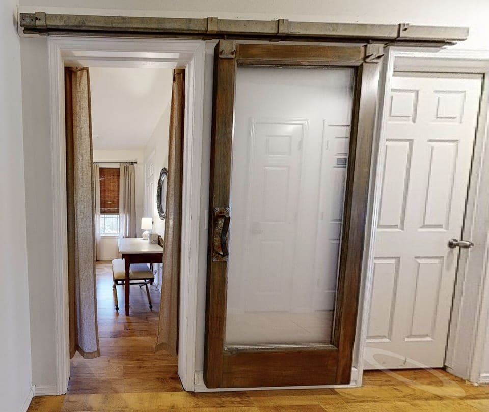 Bunk Room door is glass sliding barn door.