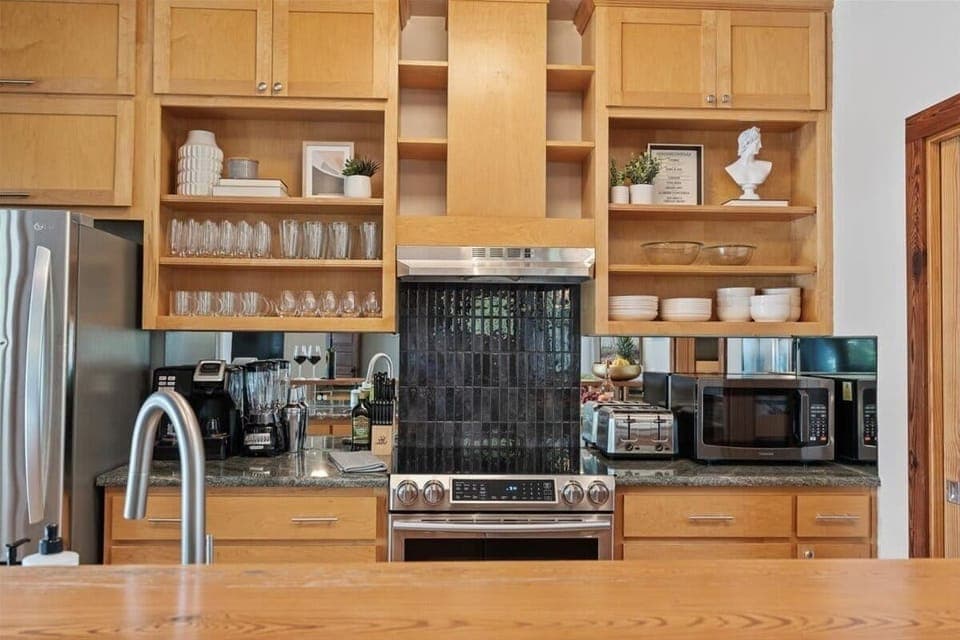 Cooking made easy and stylish—wooden cabinets and all the essentials for your perfect stay.