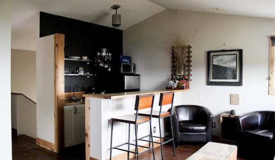 Sip morning coffee at the bar before heading to town.