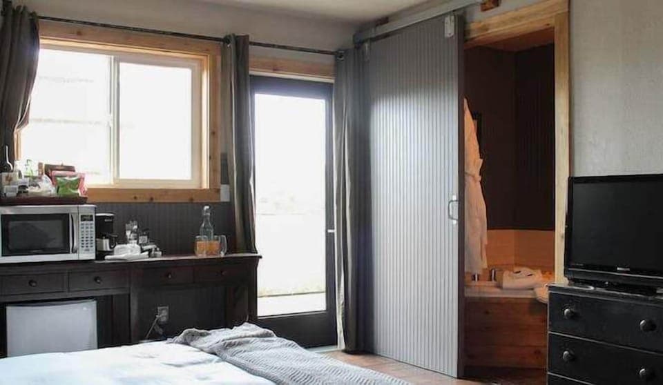 Wake to sunshine and step outside through private glass doors.