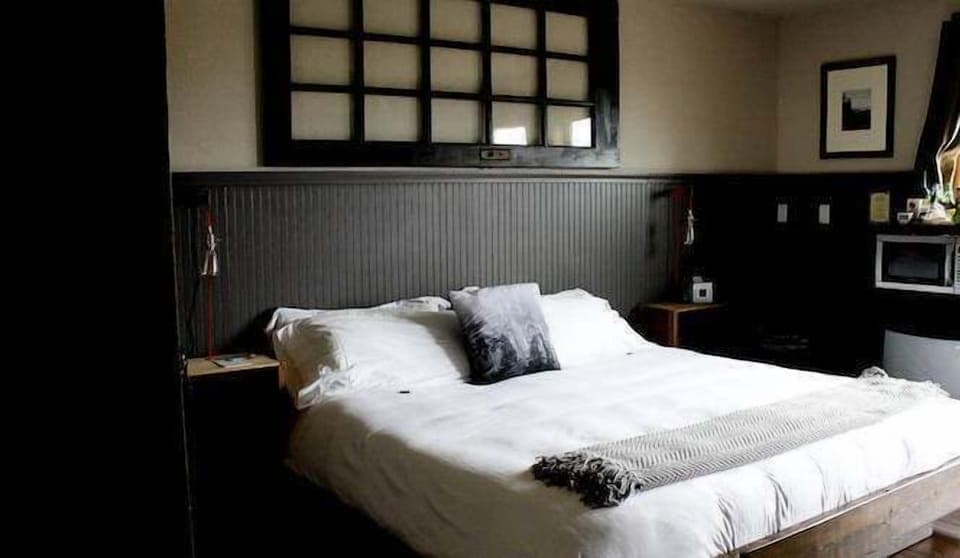 Drift off in a serene room with soft, calming tones.