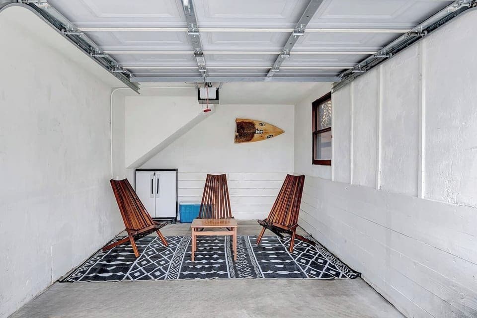 Cozy Garage Lounge: Unwind in this casual garage seating nook, perfect for morning coffee, post-beach chats, or planning your next adventure. 