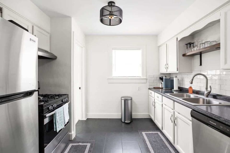 Kitchen: Bright and airy space with modern appliances, sleek countertops, and stylish decor!
