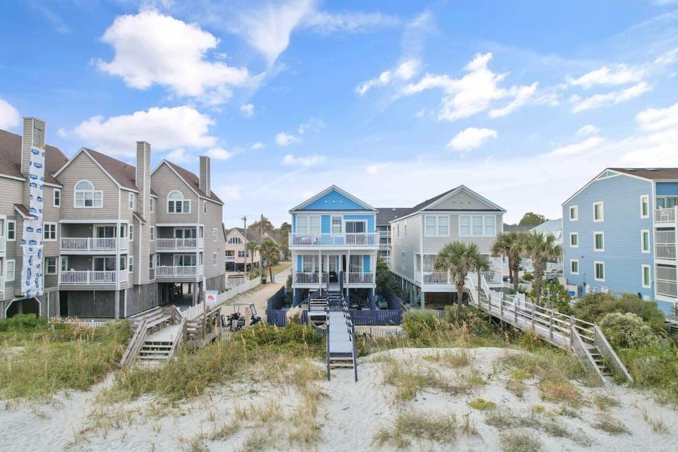 Coastal vacation home on the beachfront with direct access to pristine sandy shores and ocean views.